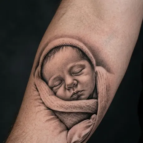 Baby portrait tattoo on skin